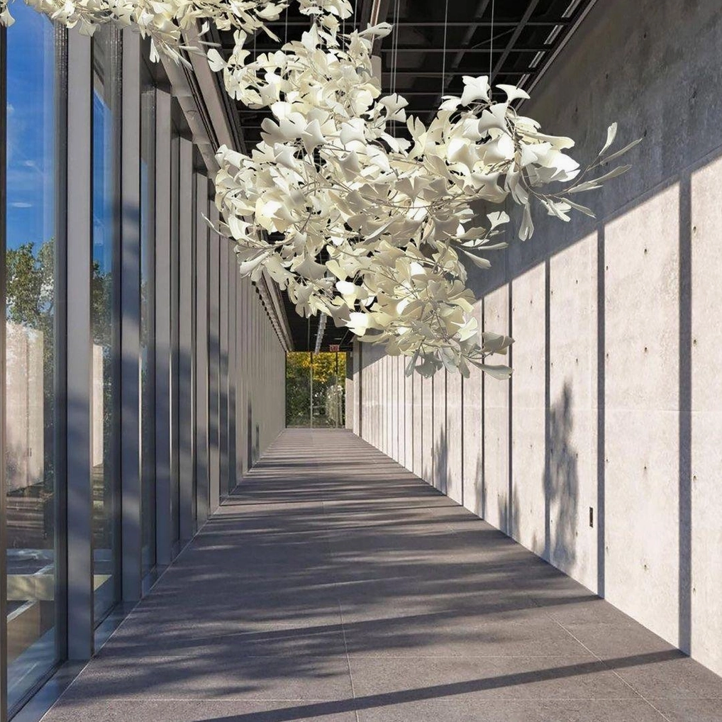 Multi-unit ginkgo leaf chandelier showing four integrated sculptural light modules suspended together