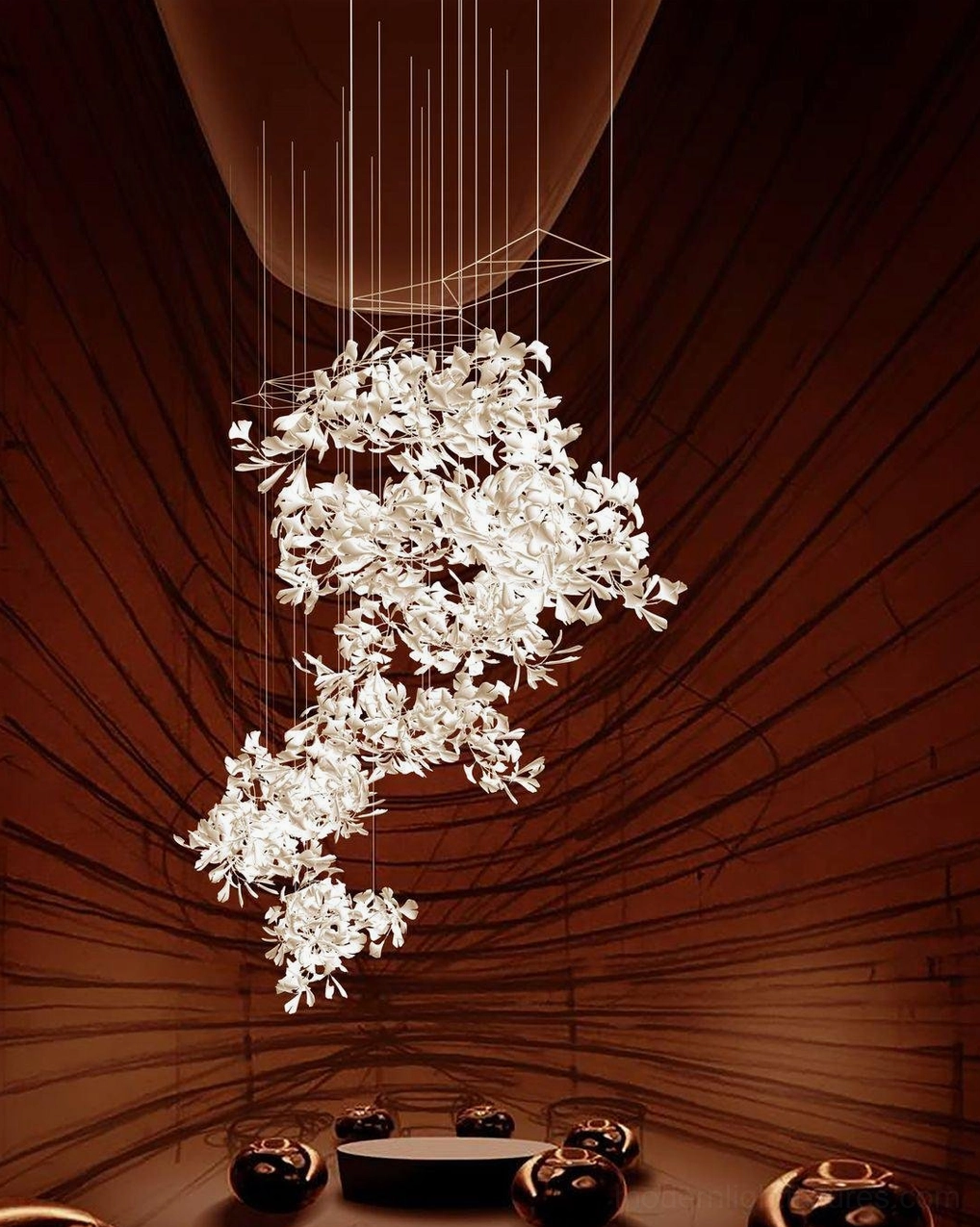 White ceramic ginkgo leaf pendant chandelier three-quarter view displayed in luxury restaurant dining area