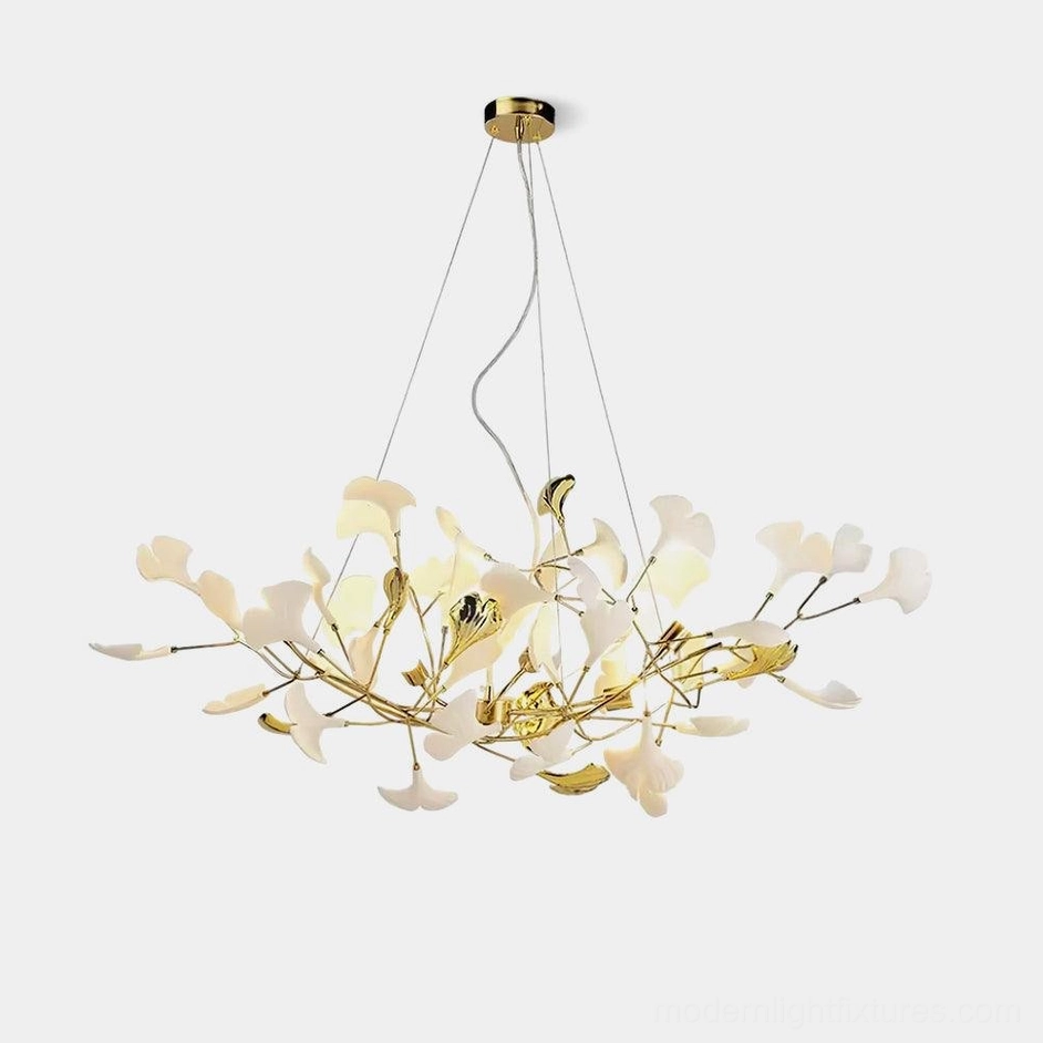 Modern white ceramic ginkgo leaf chandelier with gold metal frame against pure white background - modern pendant light fixture