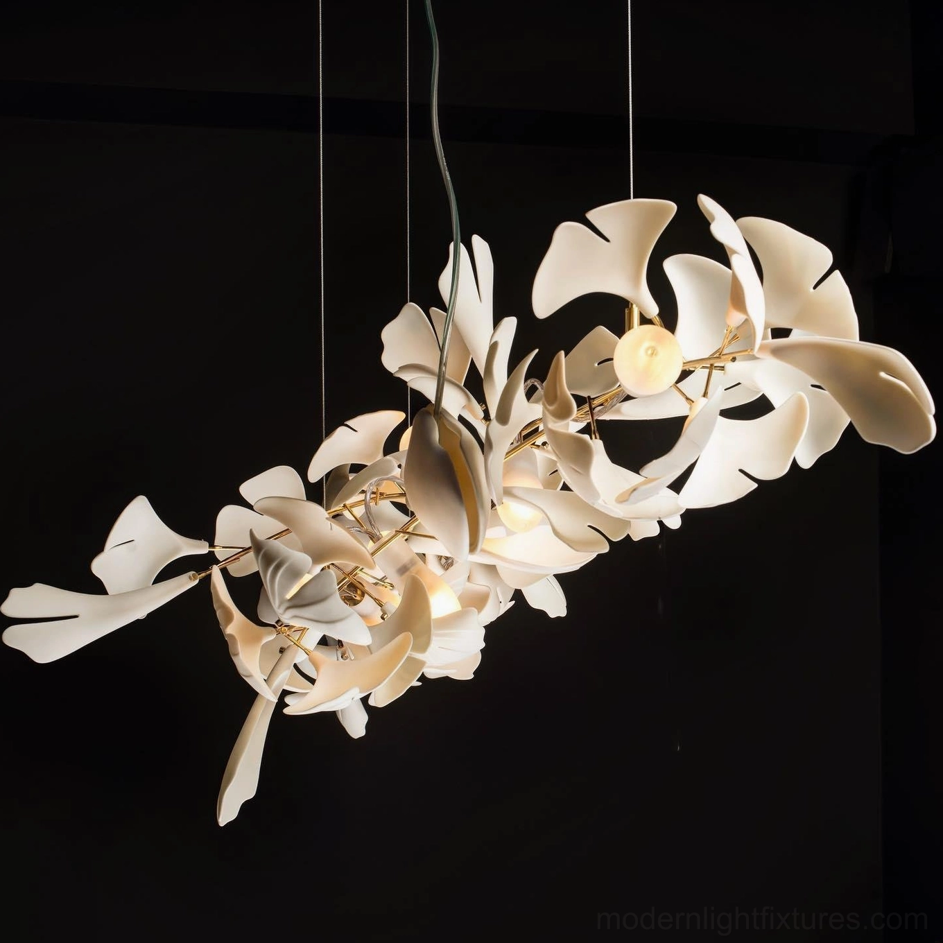 Ginkgo leaf ceramic pendant fixture detail showing leaf texture and metal branch construction