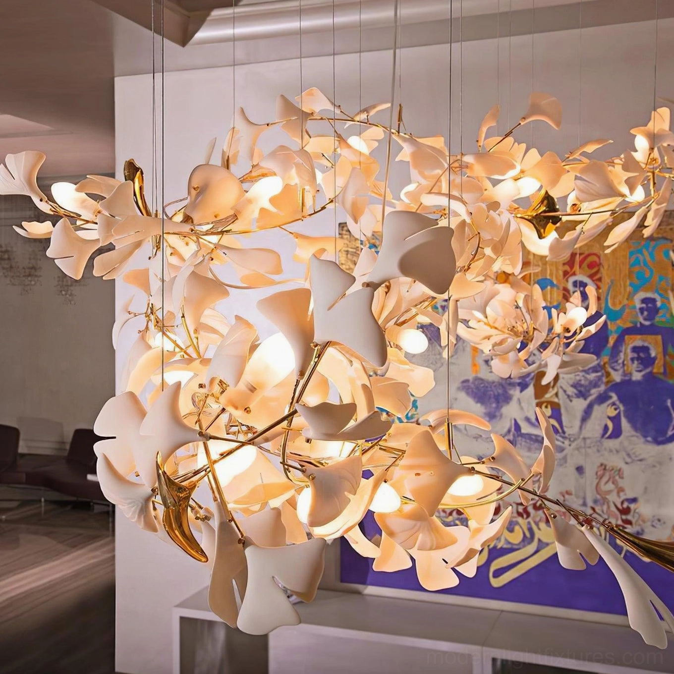 Ginkgo leaf chandelier close-up frontal view in art display space with warm glowing lights, intricate metal branch framework, mixed off-white and gold leaf details