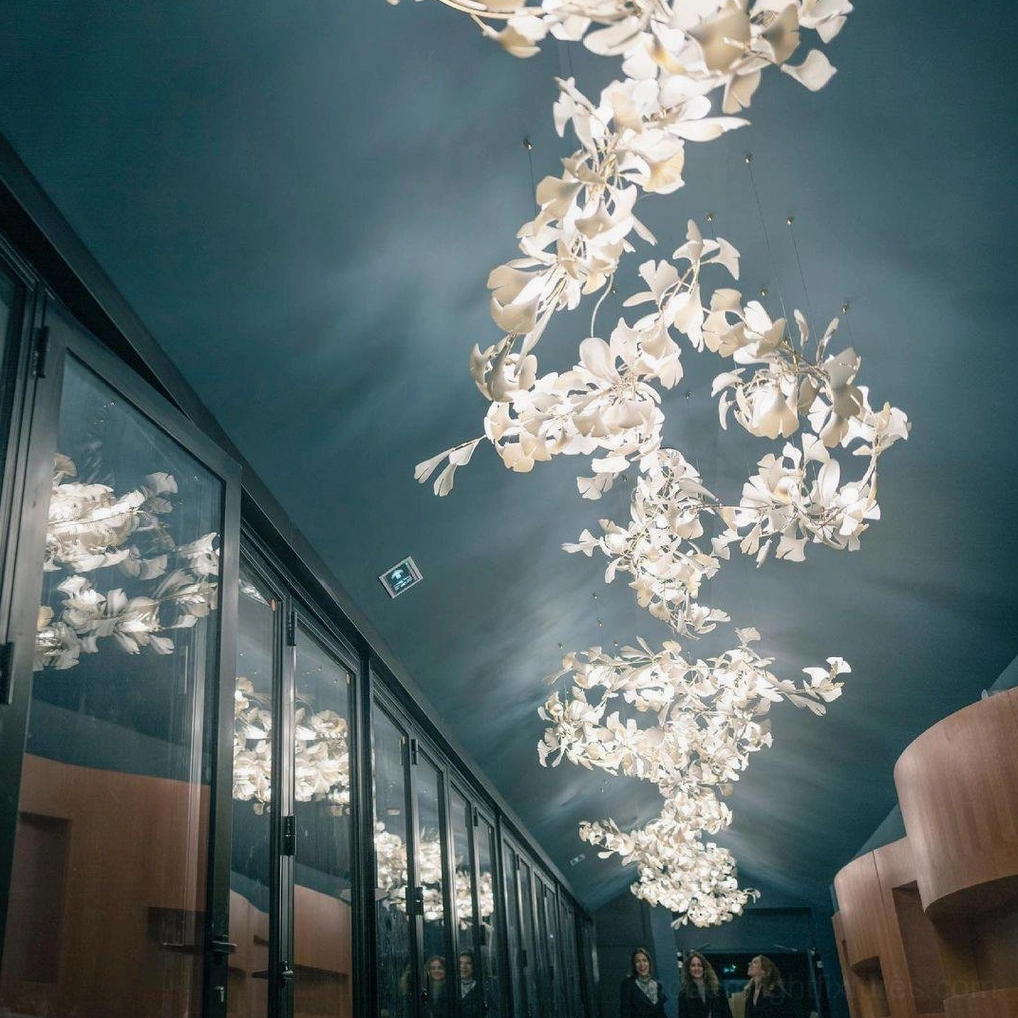 Ginkgo leaf chandelier modern interior design statement piece with mixed metal and ceramic materials
