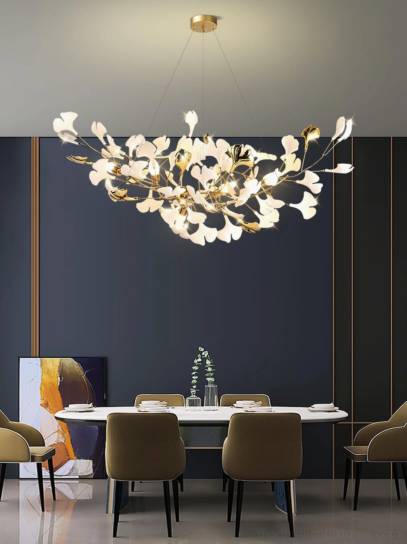 Ginkgo leaf ceramic chandelier above dining table - gold metal frame in modern luxury dining room with dark blue accent wall