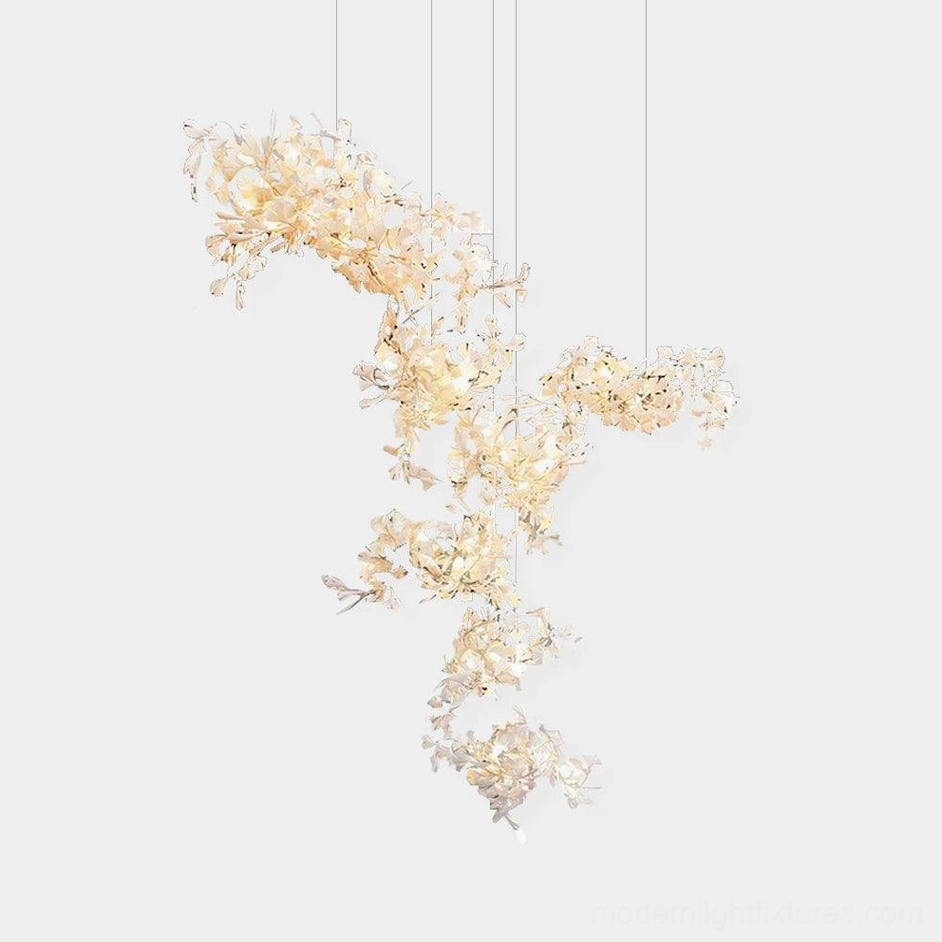 Ginkgo leaf chandelier front view showing off-white ceramic leaves on metal branches against pure white background