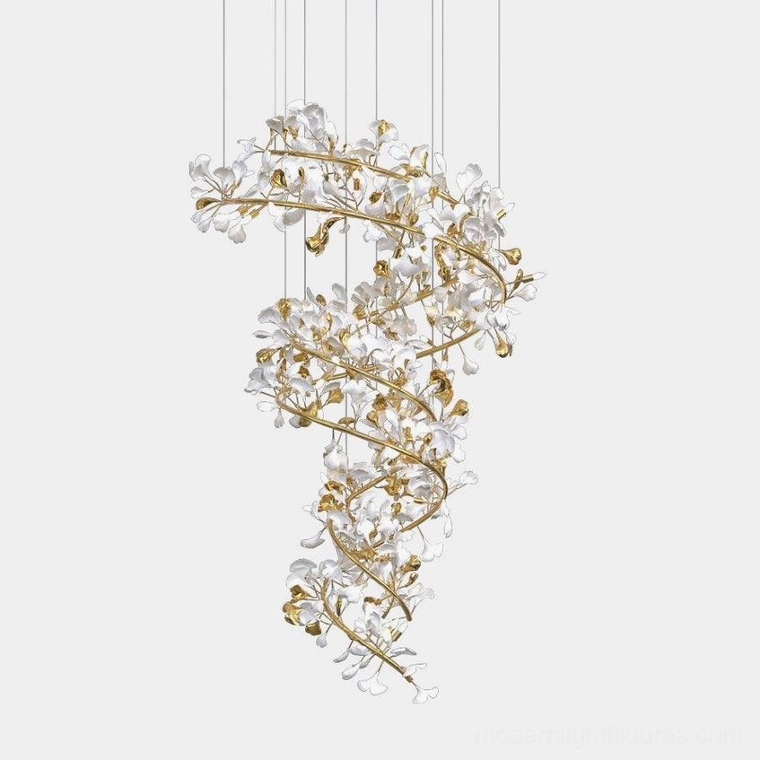Ginkgo leaf crystal pendant chandelier with gold metal frame and white ceramic leaves, frontal view against white background