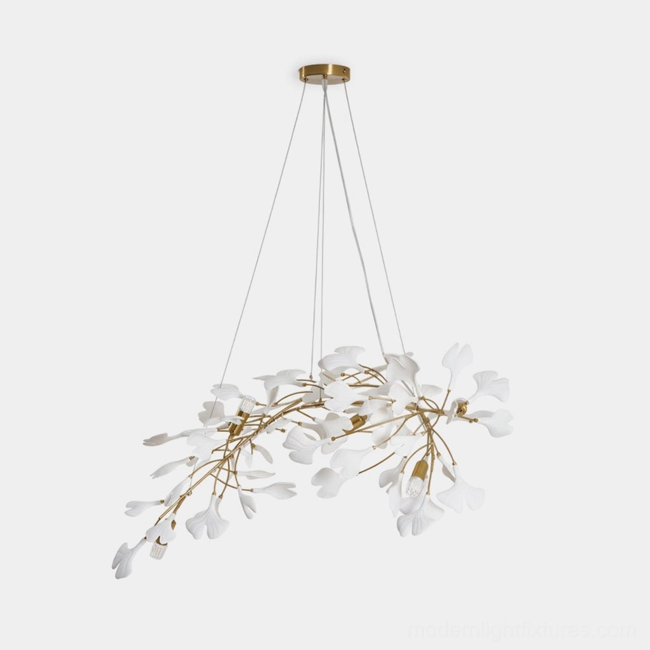 Ginkgo leaf chandelier front view with gold metal branches and white ceramic leaves on studio white background