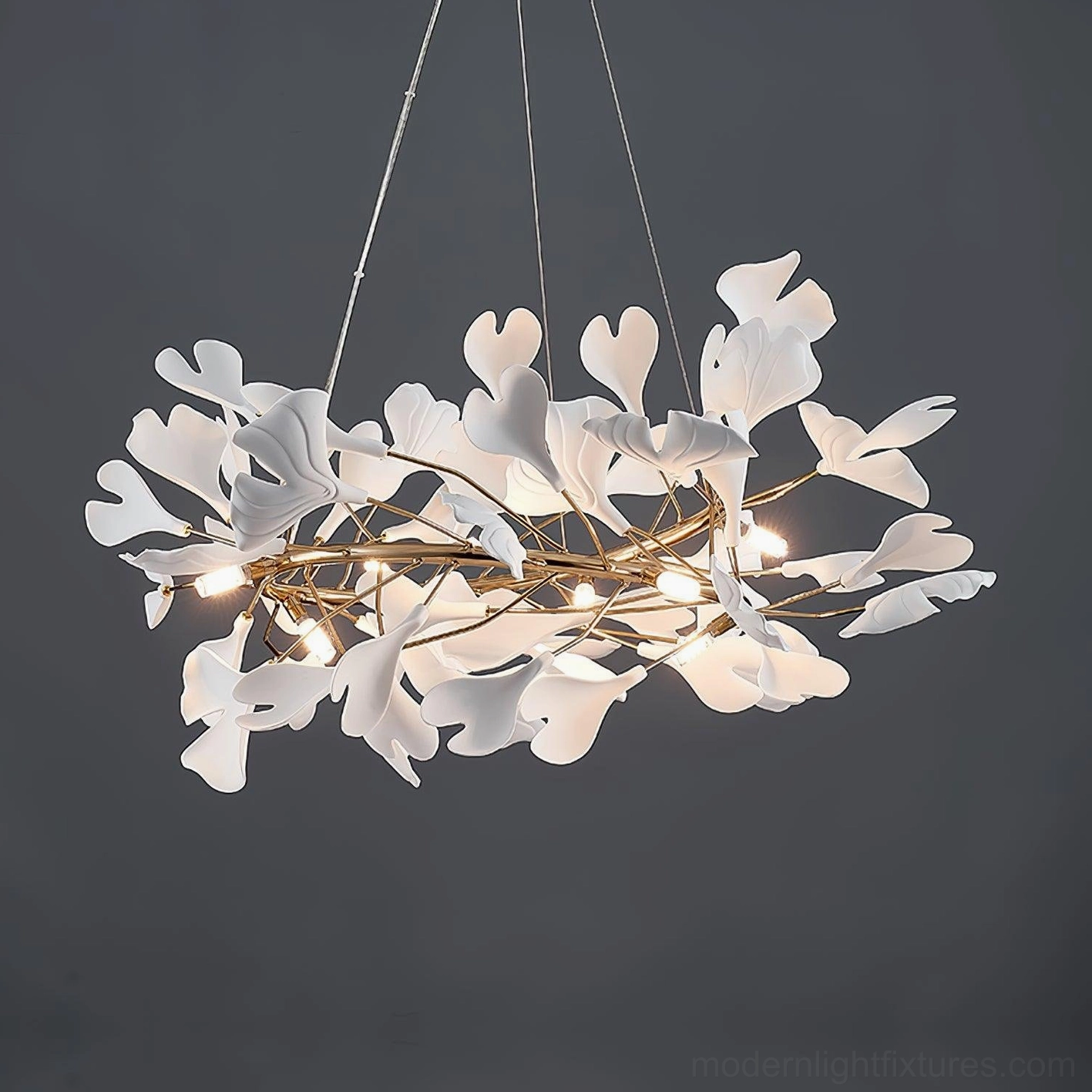 Ginkgo leaf chandelier in contemporary minimalist space with white and gold finish