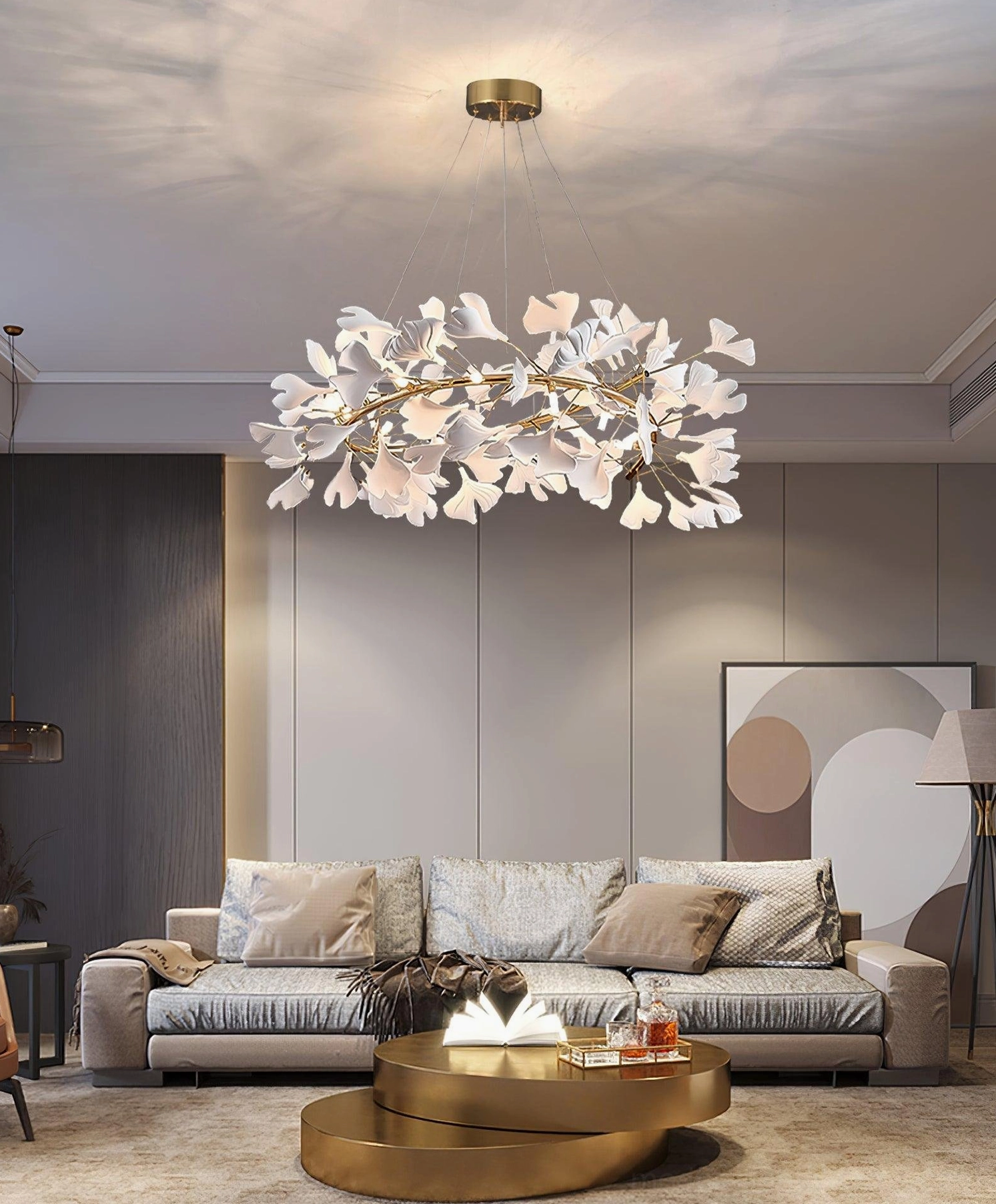 Sculptural ginkgo leaf pendant chandelier in modern living room with sectional sofa
