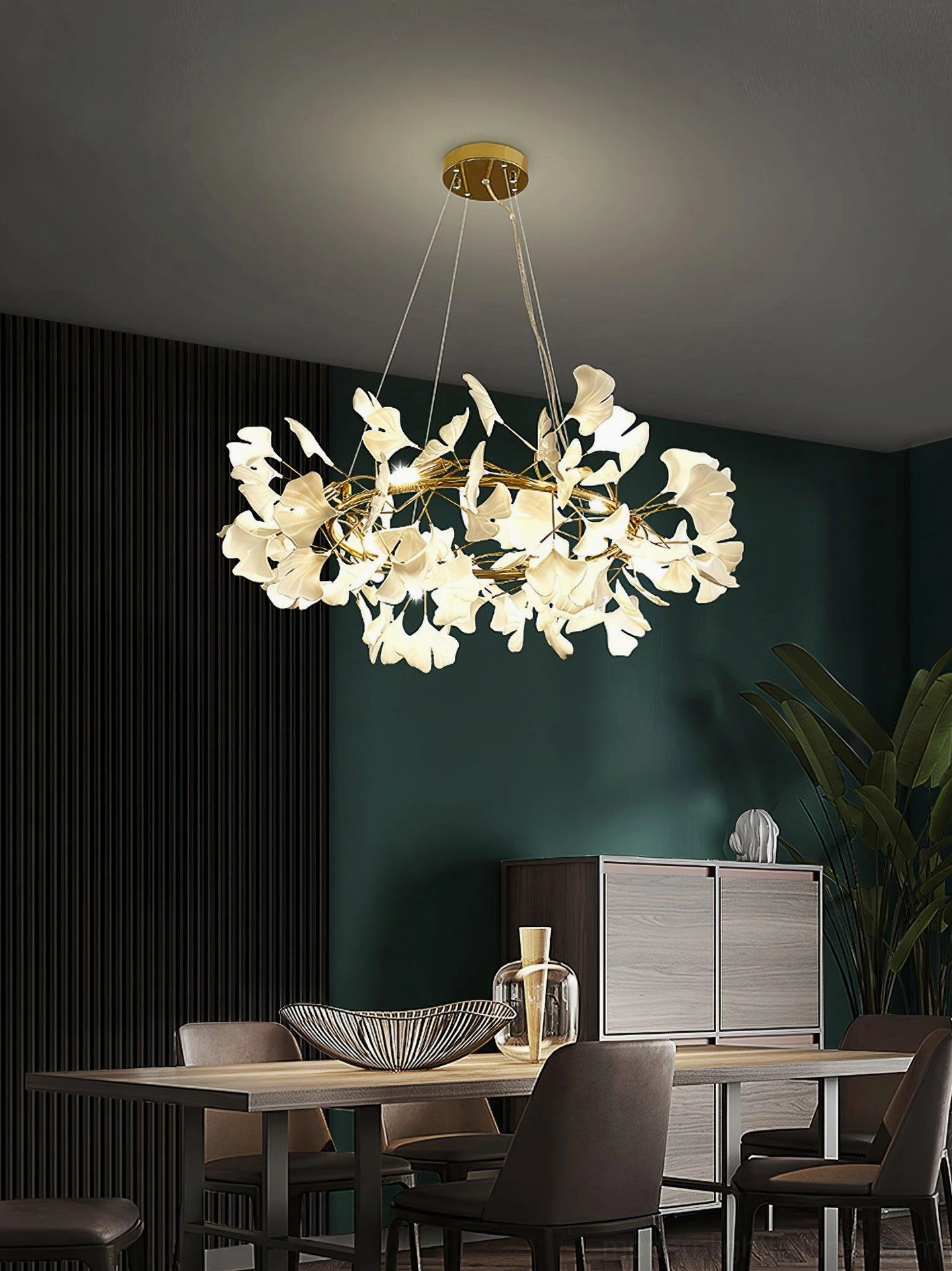 Overhead view of ginkgo leaf chandelier O with gold structure and ceramic leaf shades creating warm ambient lighting