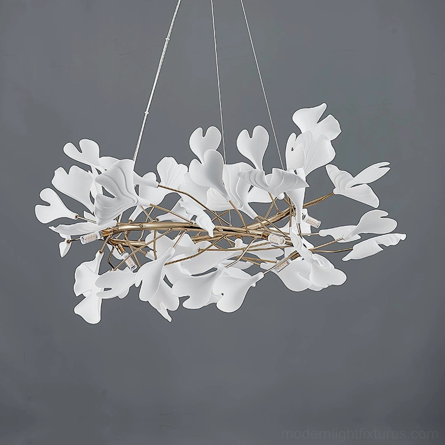 Side angle view of modern ginkgo leaf pendant chandelier with ceramic leaf cluster