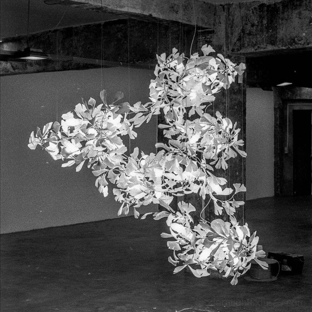 Ginkgo pendant chandelier underside view displaying ceramic leaf details and electrical components