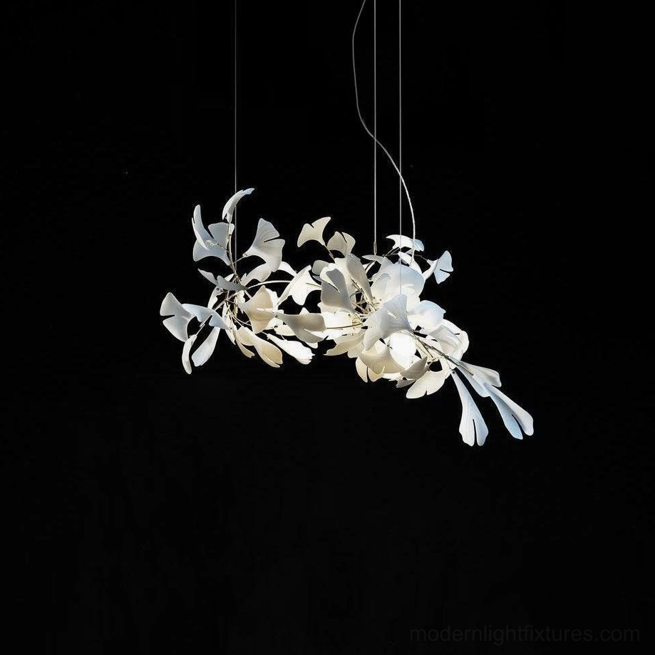 Ginkgo leaf chandelier unlit showing matte white ceramic leaves and polished metal branches