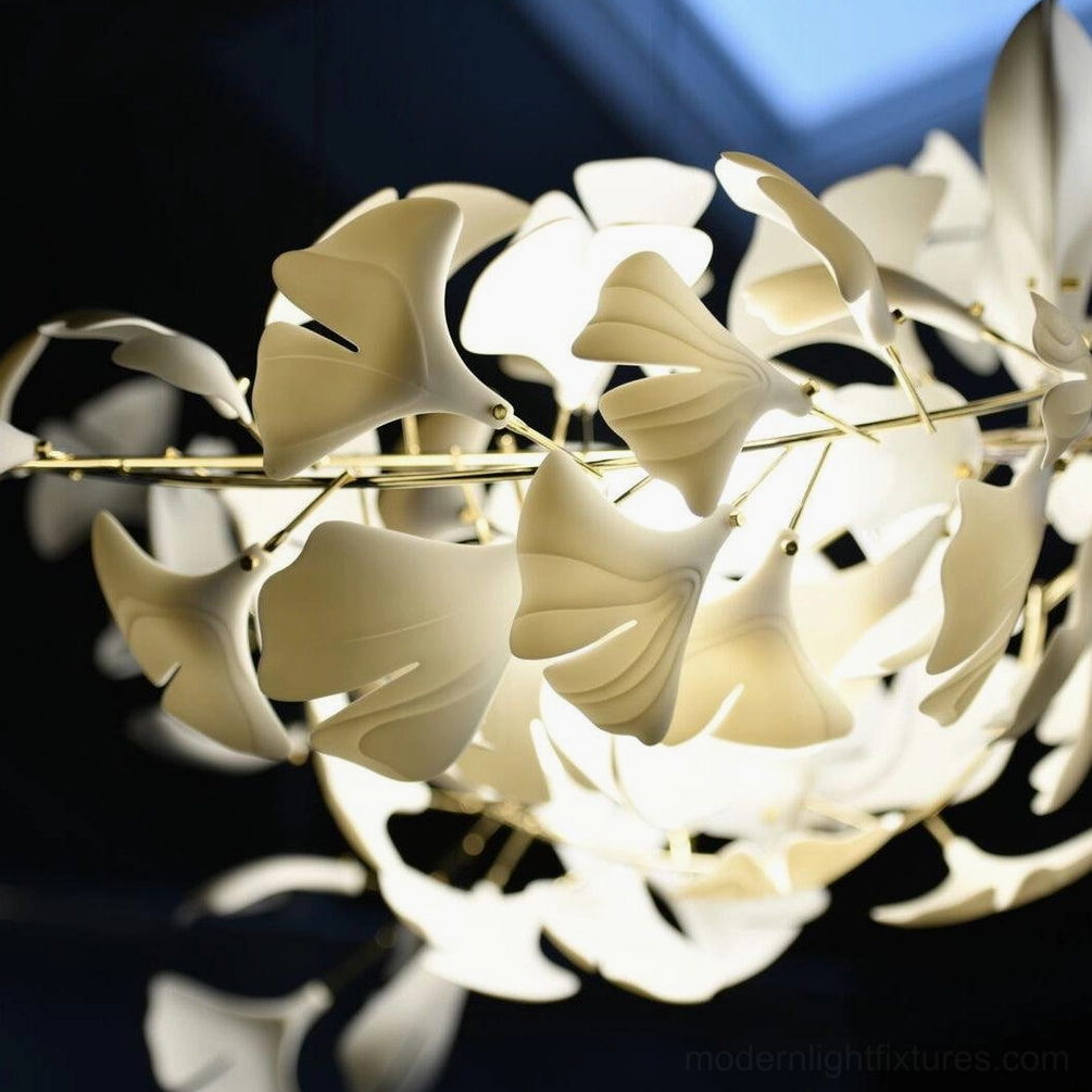 Ginkgo leaf chandelier detail close-up showing ceramic leaf texture and metal branch construction quality