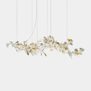 Modern ginkgo leaf linear pendant chandelier in white ceramic and gold finish, front studio view against white background