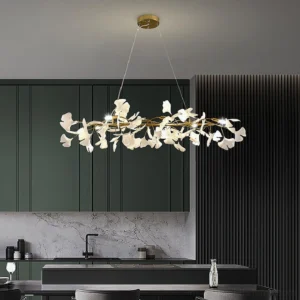 Modern linear ginkgo chandelier with warm LED lighting suspended above kitchen island dining area
