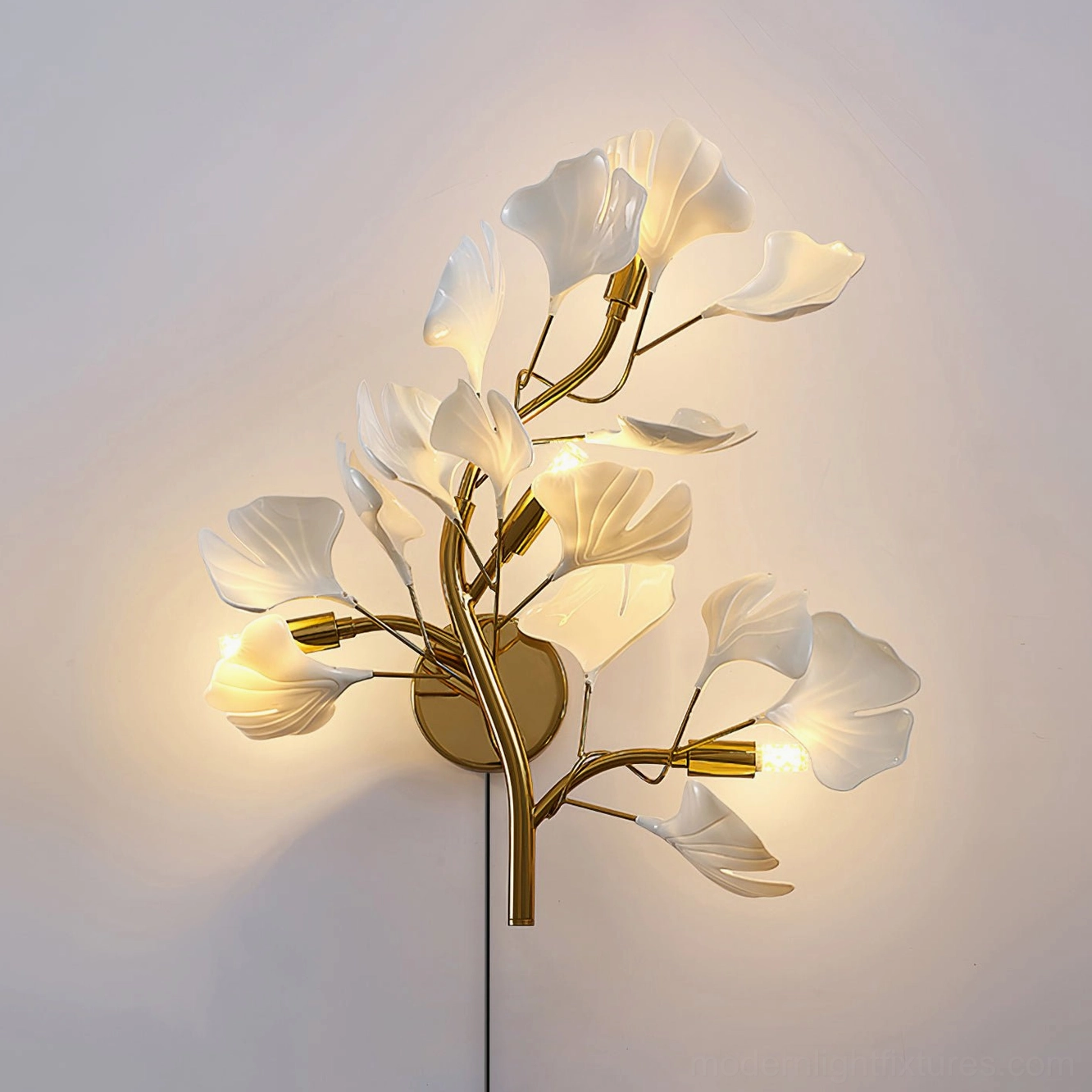 Ginkgo leaf plug-in wall sconce botanical sculpture in modern home decor setting with warm glow
