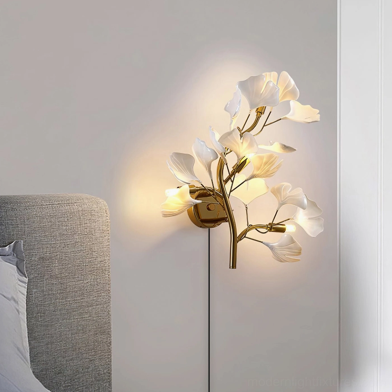 Ginkgo leaf wall sconce installed above console creating dramatic accent lighting in contemporary space