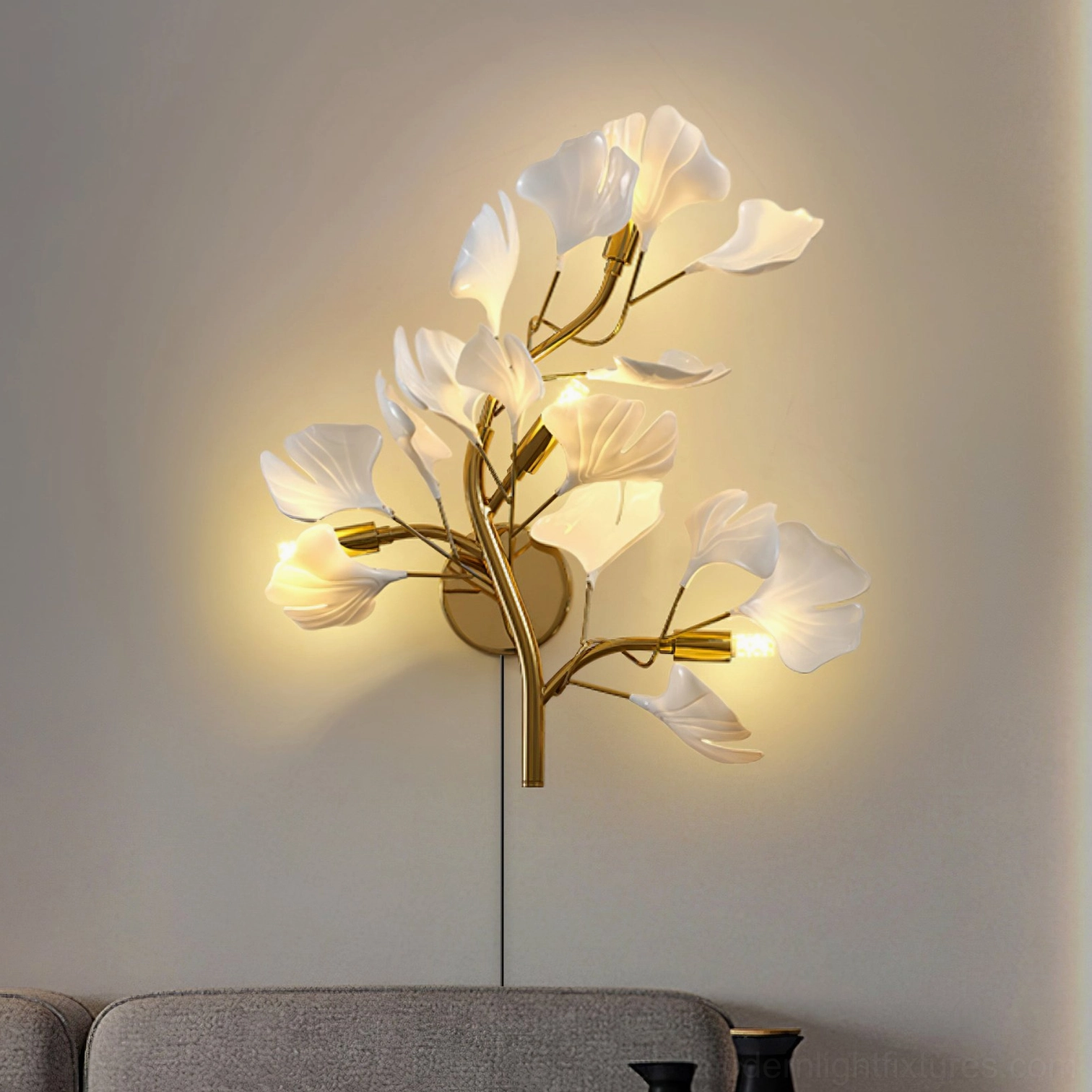 Ginkgo leaf plug-in wall sconce in living room sofa wall scene with warm illumination and fabric seating