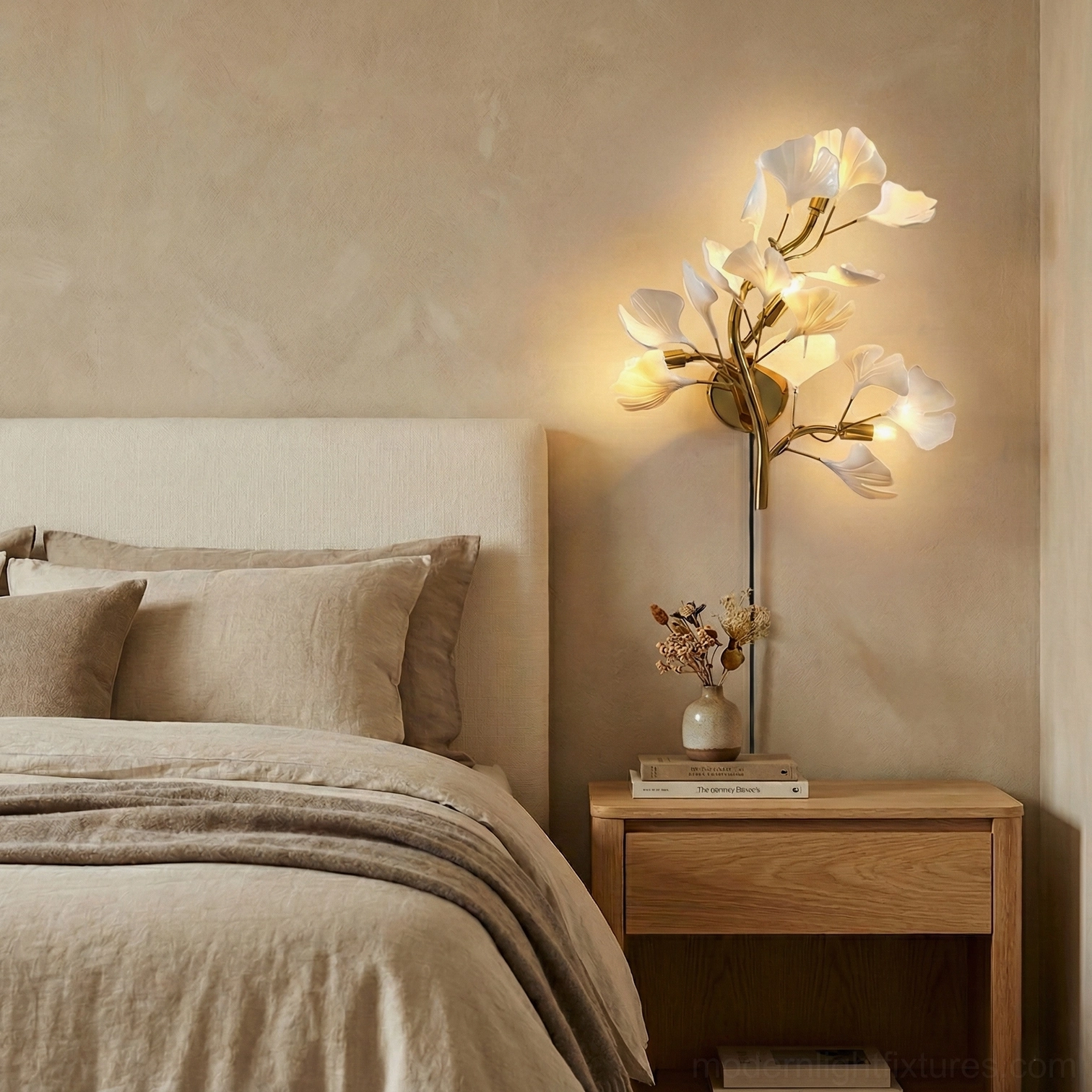 Ginkgo leaf wall sconce installed in master bedroom bedside scene with wood nightstand and warm glow