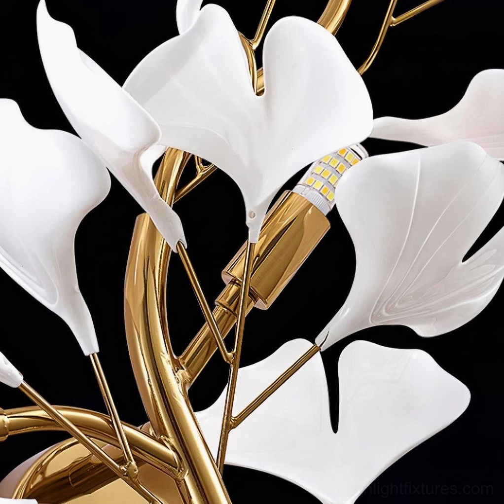 Premium ginkgo leaf plug-in wall sconce with gold frame and white acrylic leaves in luxury interior setting
