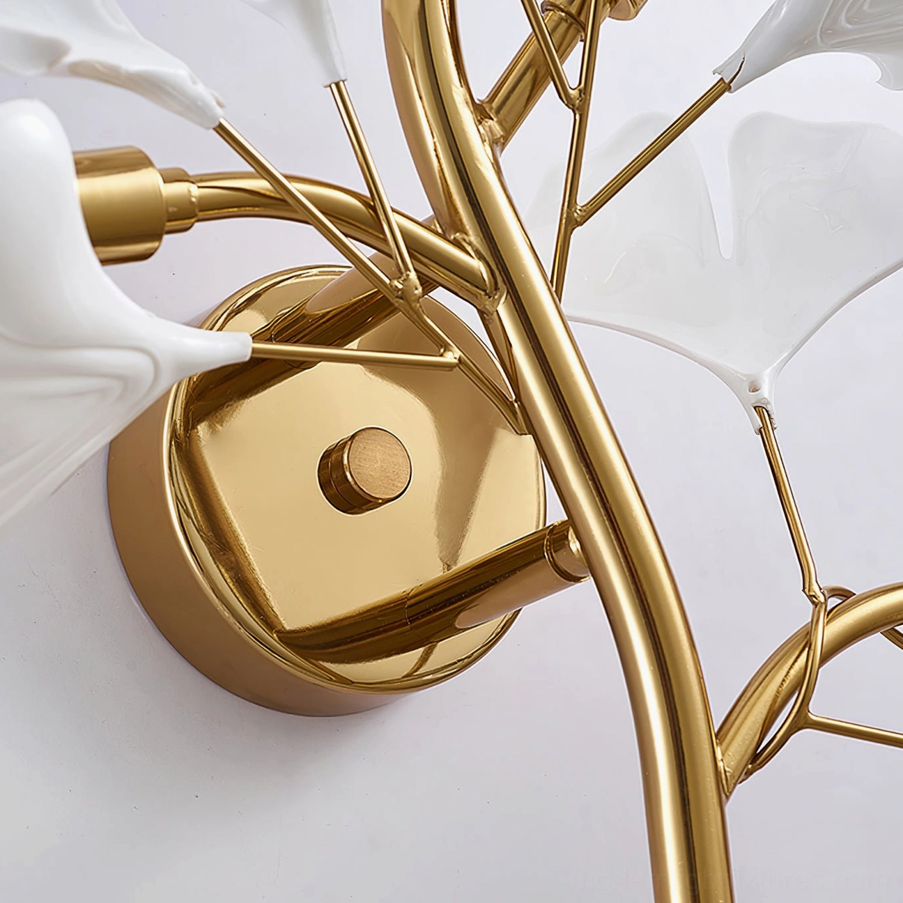 Ginkgo leaf wall sconce in Scandinavian design interior with minimalist furnishings and botanical motif