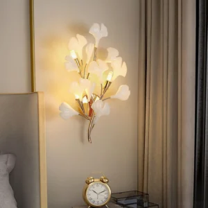 Modern ginkgo leaf wall sconce mounted in bedroom above nightstand - warm ambient lighting effect