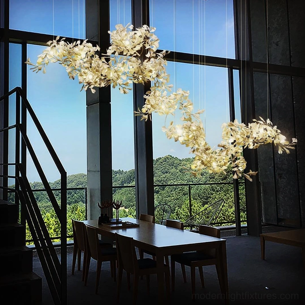 Contemporary ginkgo leaf chandelier installation demonstrating organic form and sculptural presence in high-ceiling space