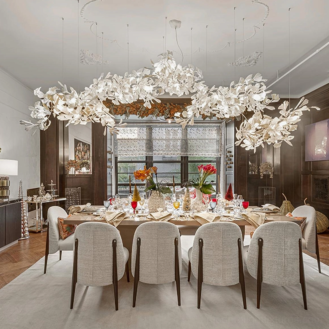 Ginkgo leaf chandelier with off-white ceramic cluster design creating warm ambient lighting in luxury dining room