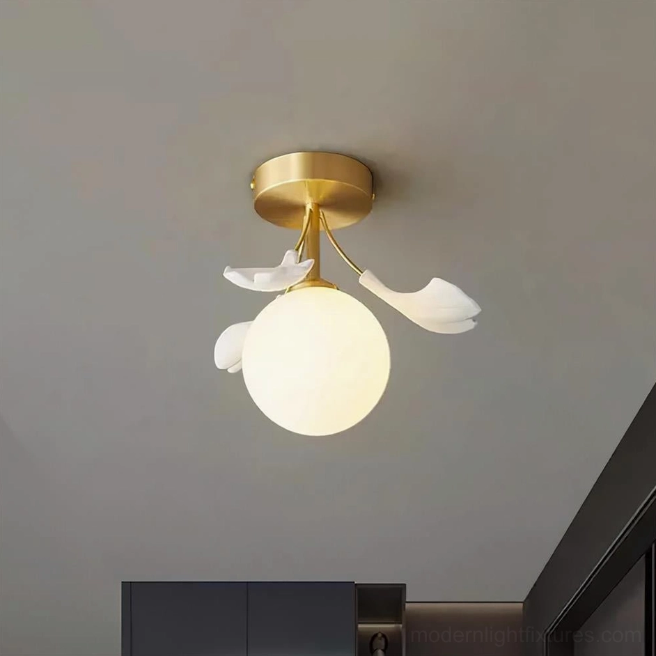 Illuminated Ginkgo Rosalia semi-flush ceiling fixture casting warm ambient light indoors