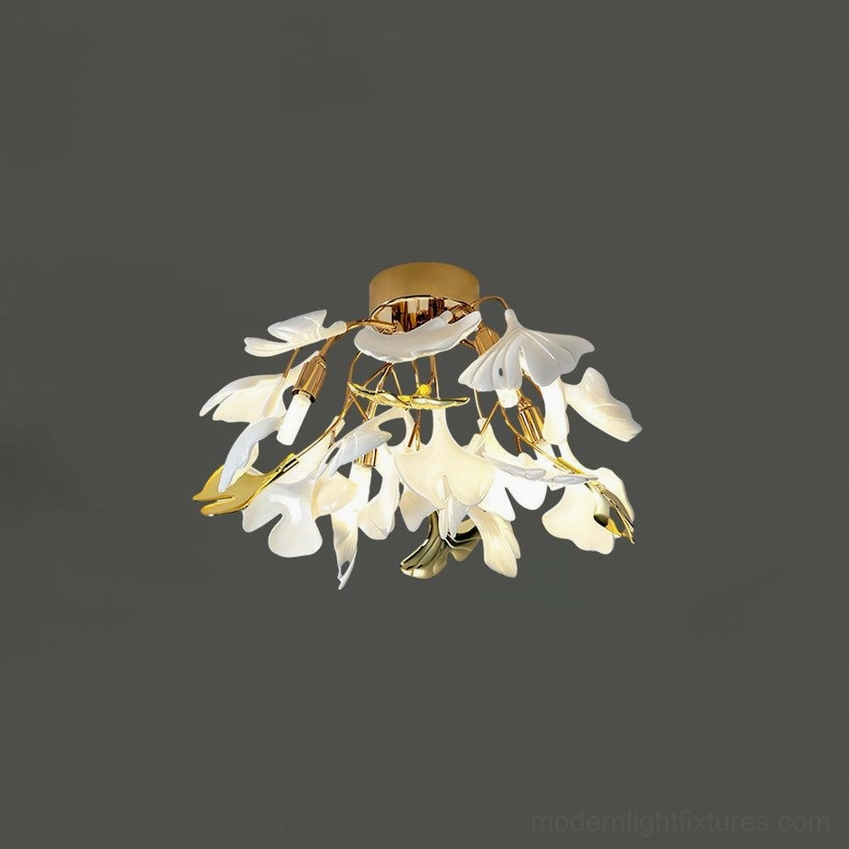 Ginkgo Valla modern ceiling light in bedroom setting with gold finish and white leaves creating warm illumination