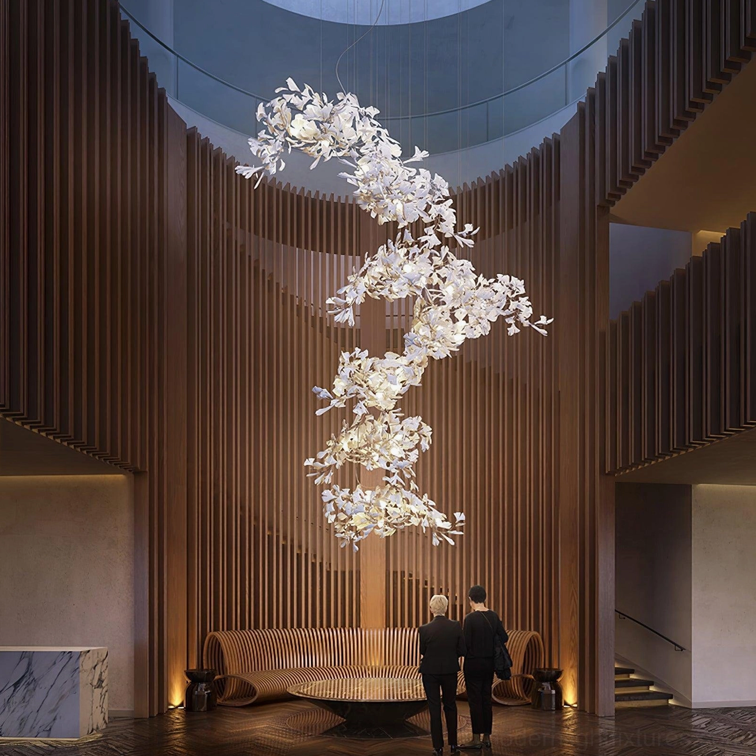 Pure white ginkgo leaf pendant chandelier wide side view in upscale hotel lobby with wooden slat walls