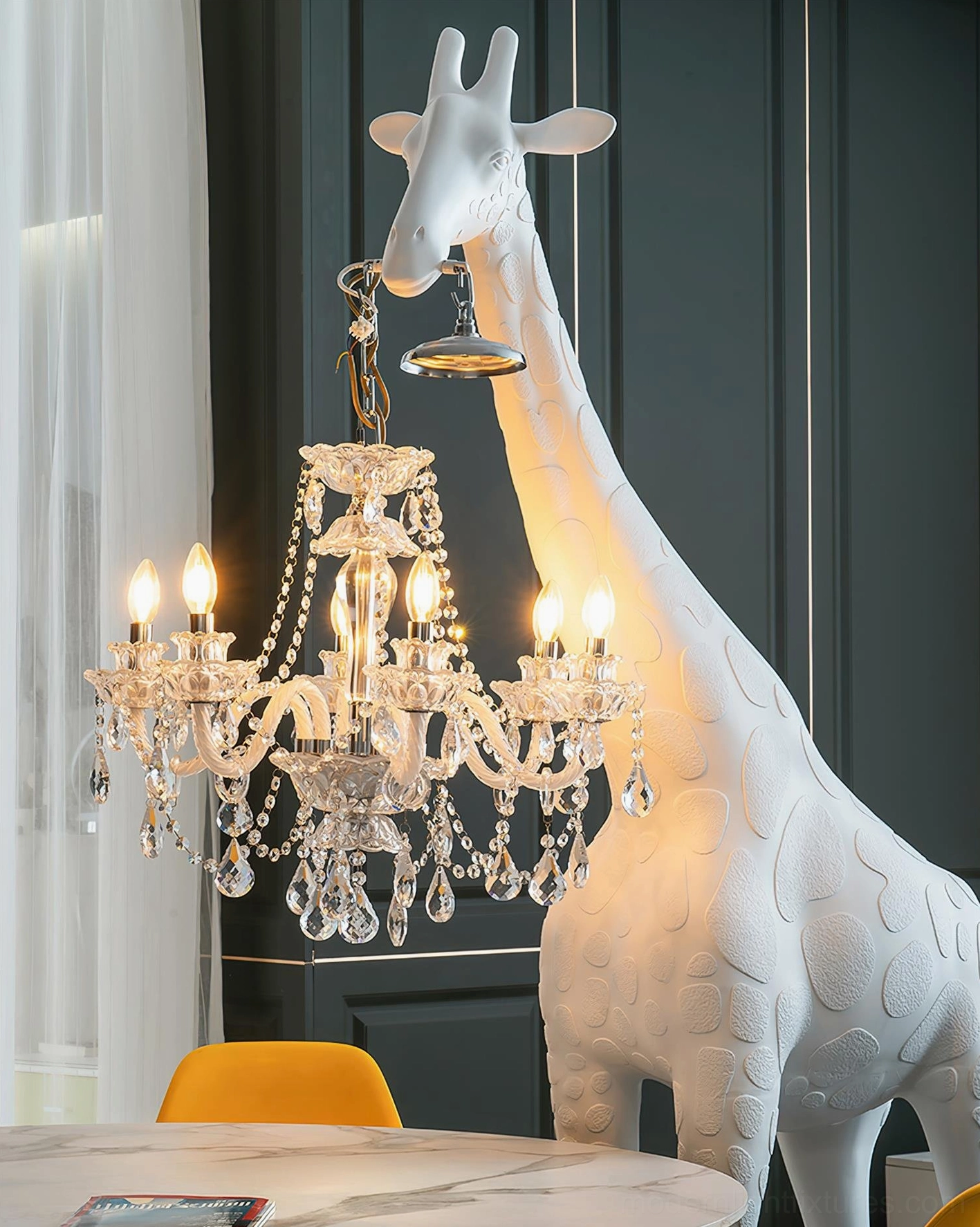 Giraffe floor lamp illuminated in upscale dining room with table and modern yellow chair, statement art lighting