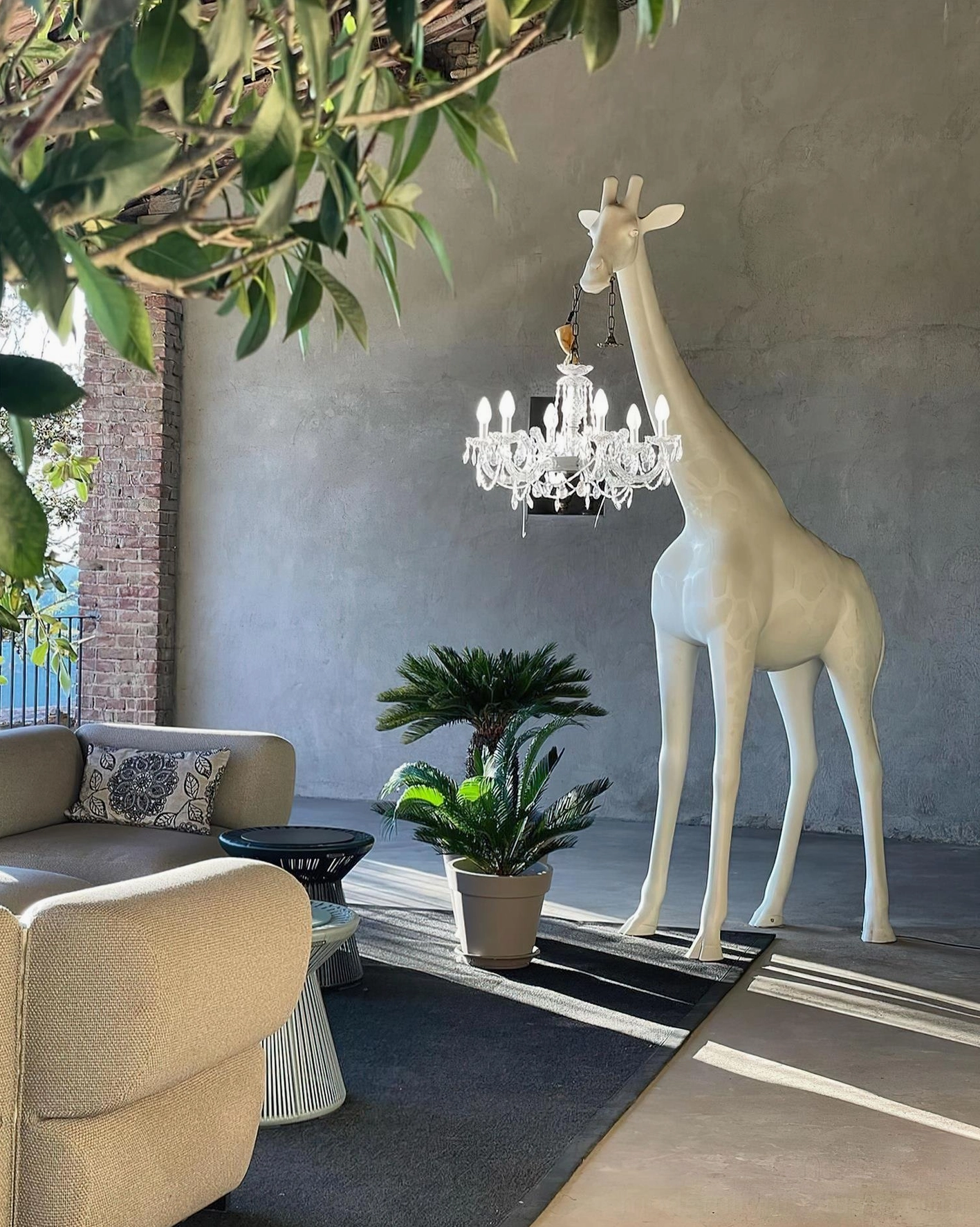 Giraffe floor lamp full view showing complete sculptural composition with crystal chandelier pendant lighting