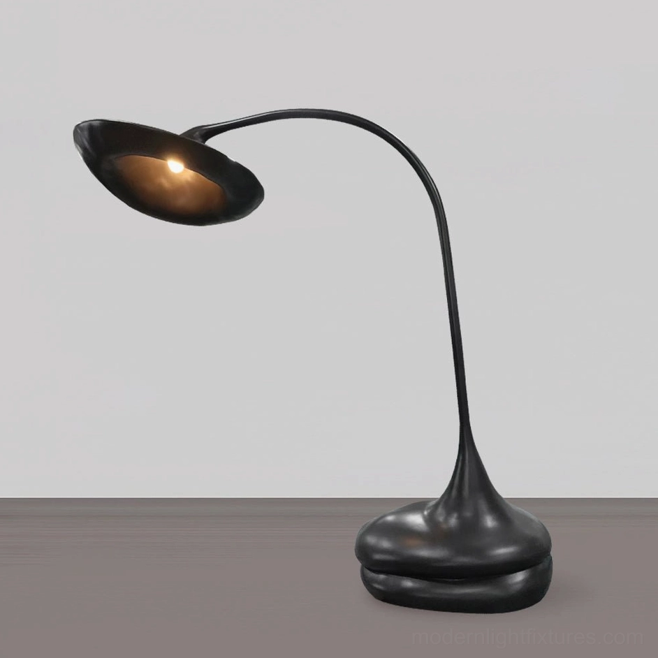 Giselle black sculptural floor lamp with warm glowing light and smooth matte finish detail