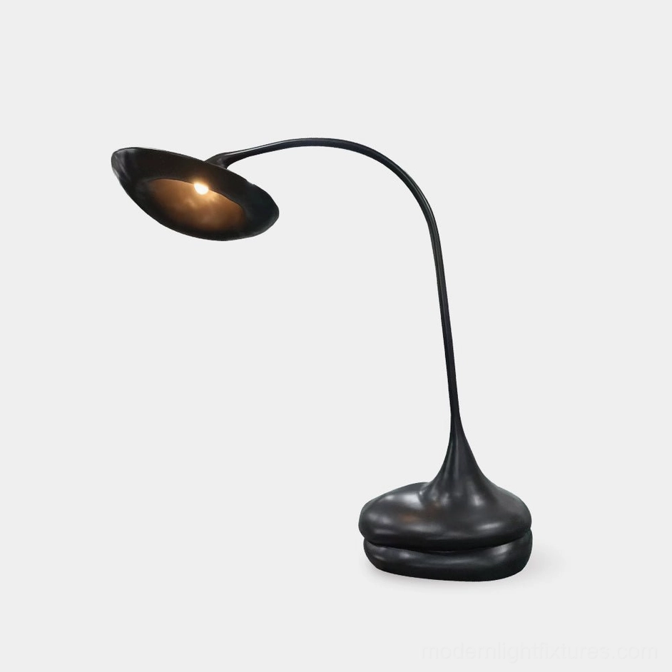 Giselle black organic floor lamp with sculptural curved base and asymmetrical shade on white background
