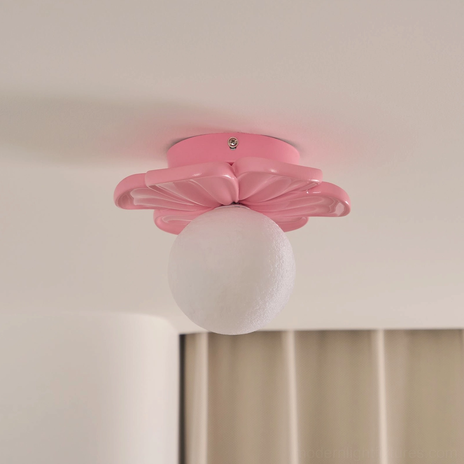 Multiple Giulia ceiling light fixtures in complementary colors creating cohesive home lighting design