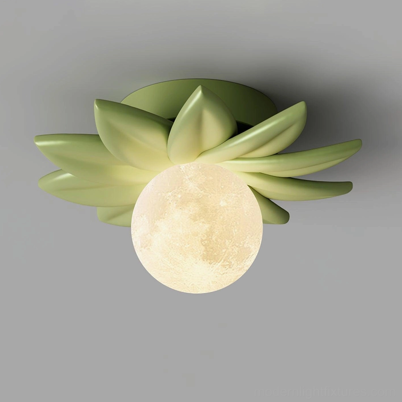 Green Giulia leaf-flower shaped ceiling light with large moon-shaped diffuser in fresh natural style on gray background