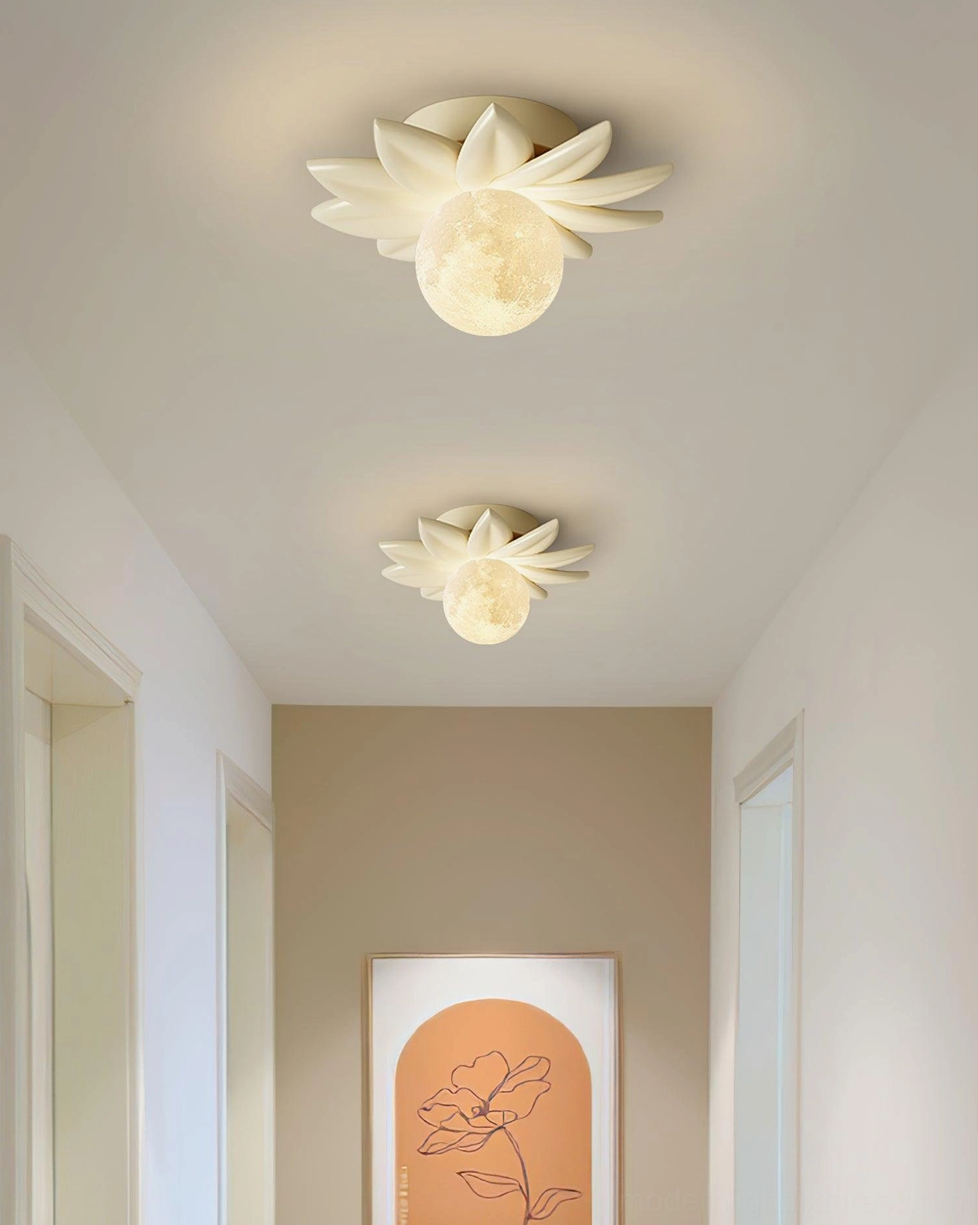 Two white Giulia flower ceiling lights with minimalist modern style installed in residential corridor with wall artwork