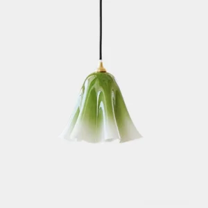 Glacea hand-blown glass pendant light with botanical bell shape and ombré green gradient finish, studio front view
