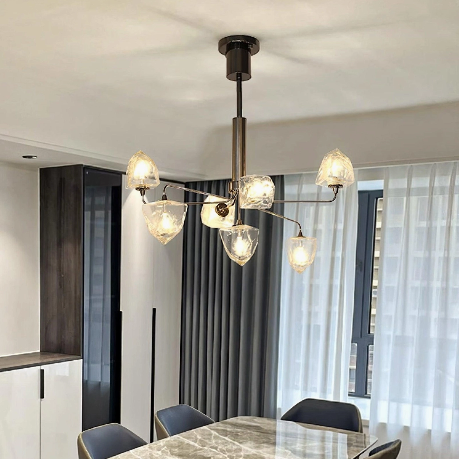 Glass chandelier with black metal frame and clear faceted shades contemporary luxury style