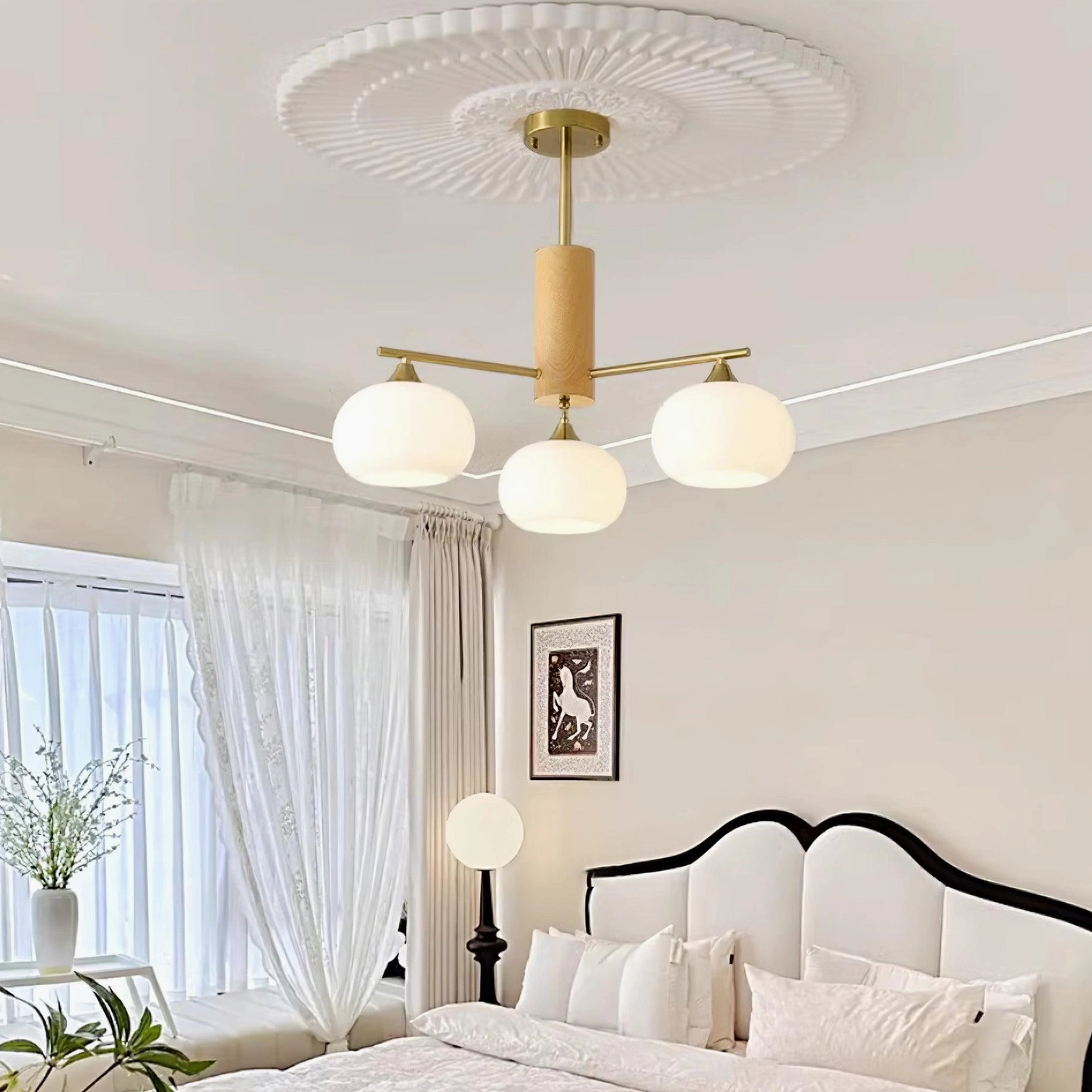 Glass pendant chandelier ceiling mount fixture with brass hardware installation detail view