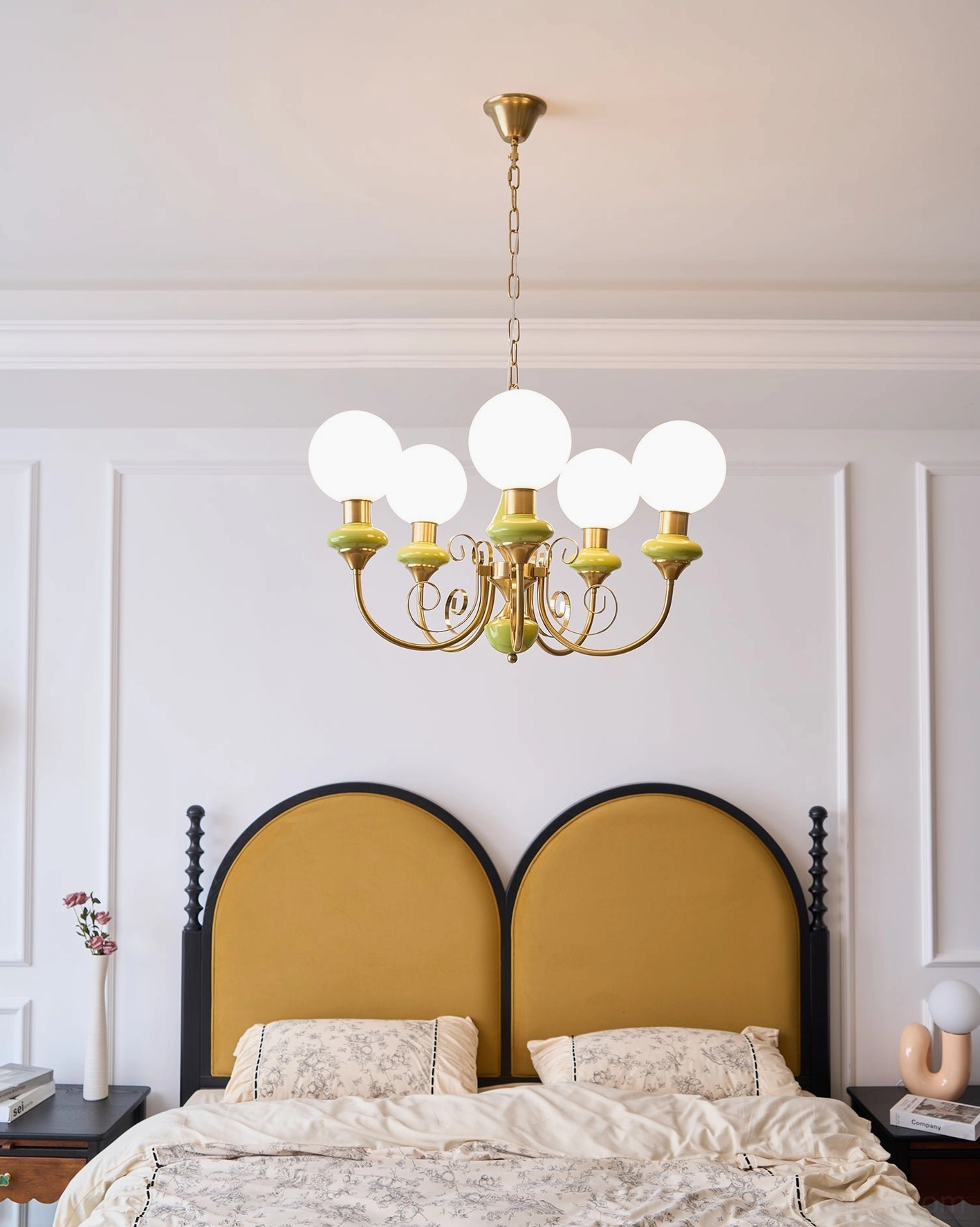 Glass chandelier with warm glow from frosted shades, mid-century modern aesthetic