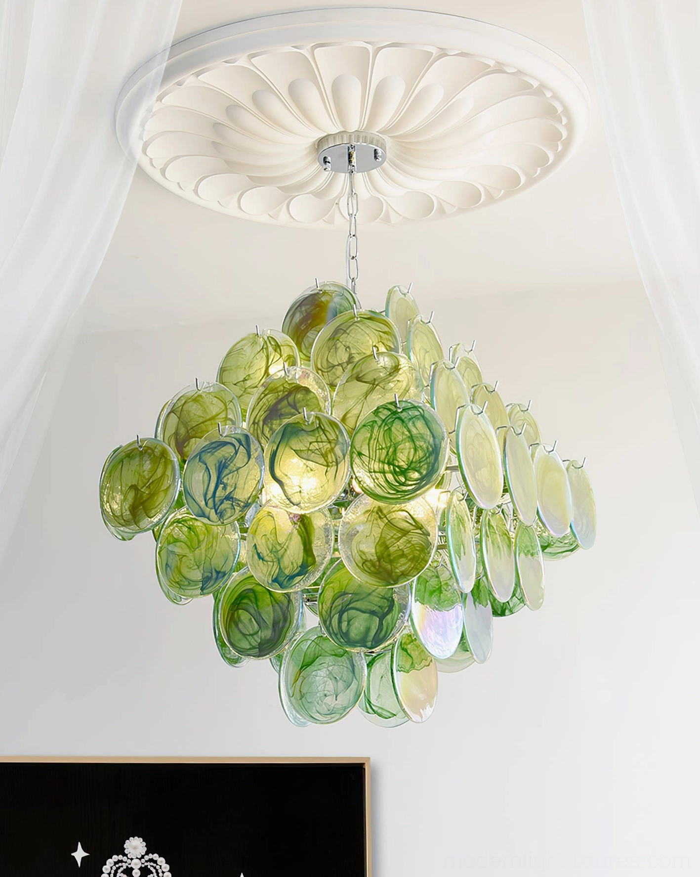 Glass disc chandelier in minimalist interior setting showcasing artistic focal point and design statement