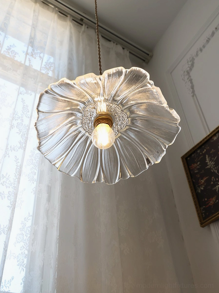 Glass flower pendant light creating soft ambient glow in modern home interior