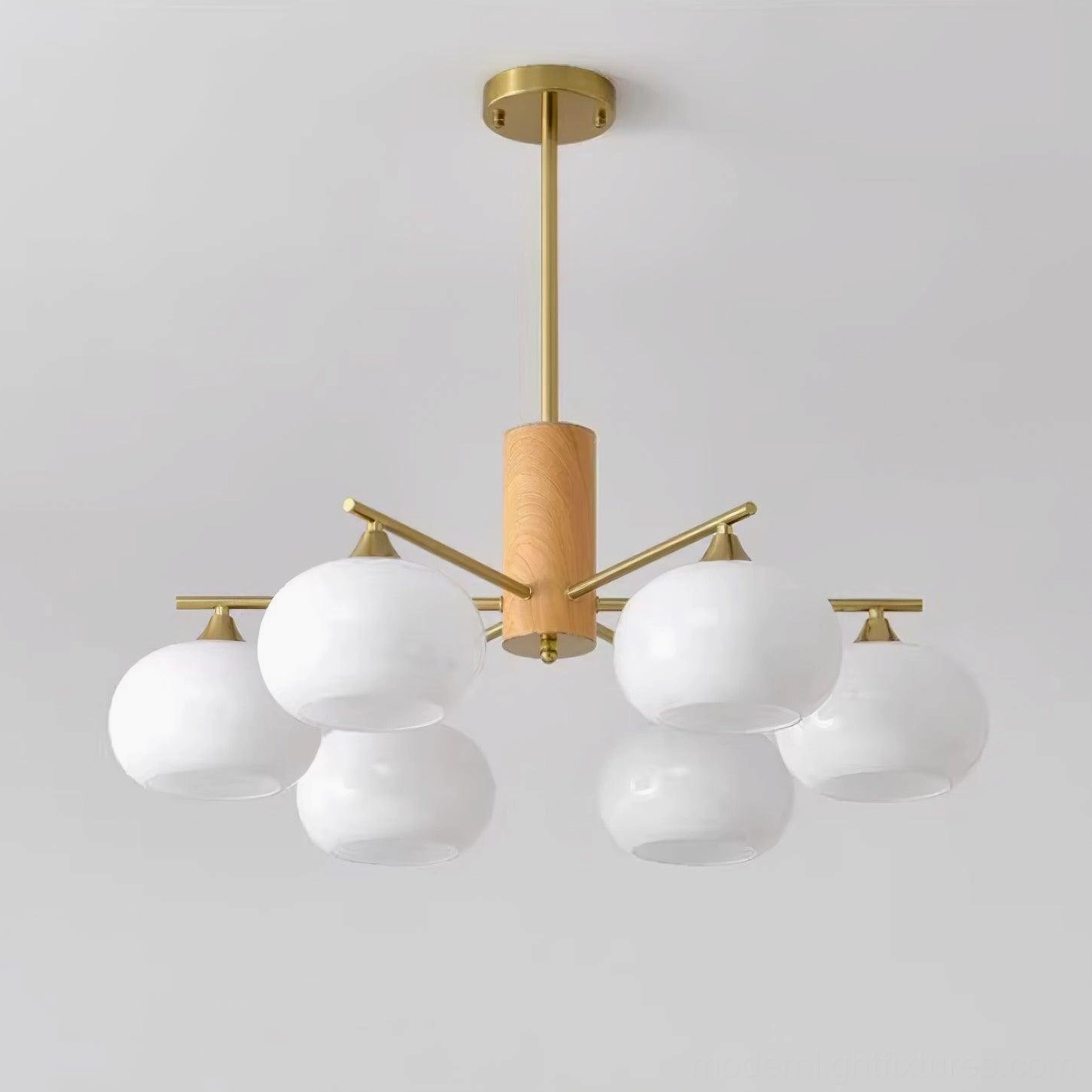 Multi-head glass pendant with brass metal frame and frosted opal shades contemporary light