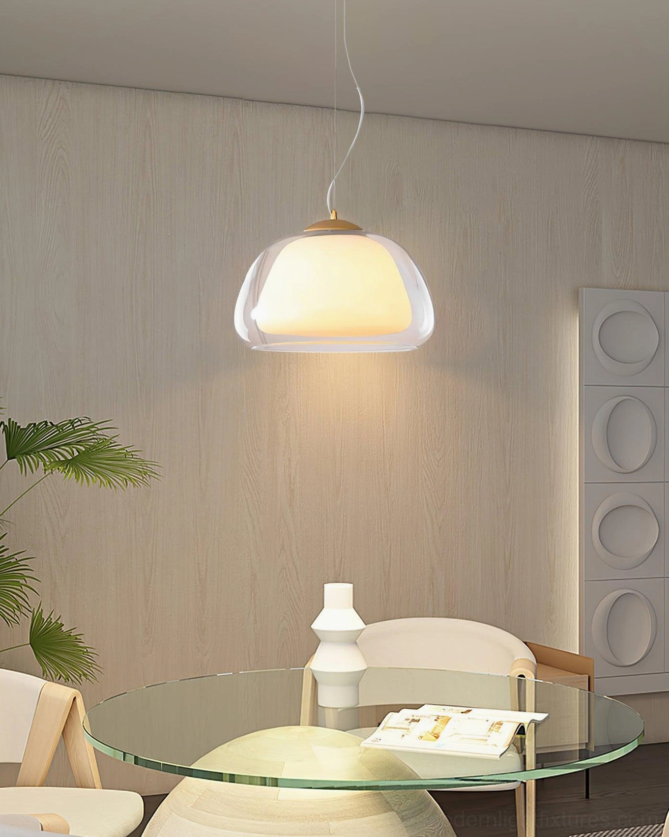 Minimalist jelly glass pendant light fixture showing clear and frosted layer construction and brass hardware detail