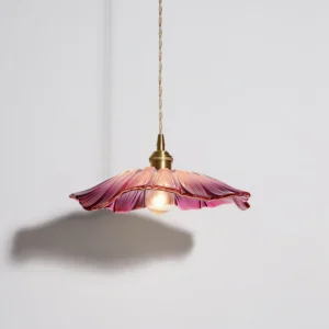 Modern glass pendant light with pink petals and exposed brass bulb holder, bottom-front view