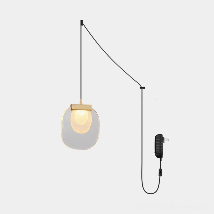 Modern glass ripples pendant light with gold metal accents and clear glass shade, studio product view