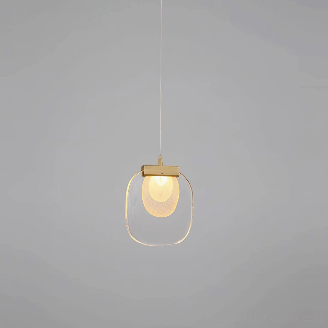 Single modern glass ripples pendant light with clear shade and warm LED illumination