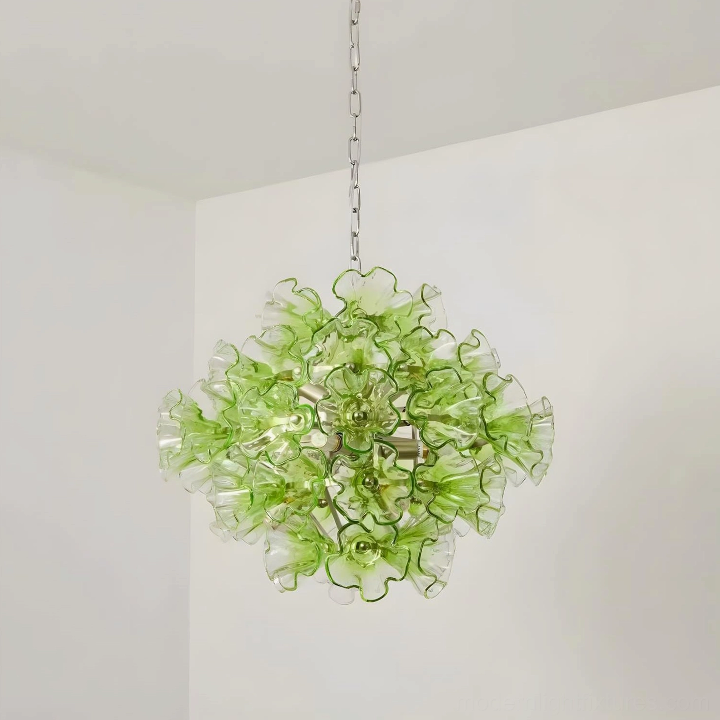 Full product range of Glassia green glass pendant lights showing three size options small medium large sculptural comparison